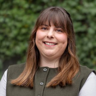 Close-up of a blooming pink rose outdoors, perfect for backgrounds or wallpapers.